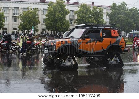 Russia, the city of Novokuibyshevsk, June 24, 2017, Technopark-2017 festival, rain and cars.