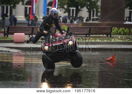 Russia, the city of Novokuibyshevsk, June 24, 2017, Technopark-2017 festival, rain and cars.
