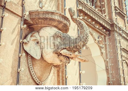 Elephant head sculpture on wall of the royal Palace of Mysore in Indo-Saracenic style, Karnataka state, India