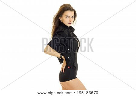 young beautiful brunette in black jacket and panties looking at the camera isolated on white background