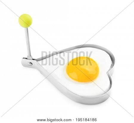 Fried sunny side up egg in heart shaped mold isolated on white