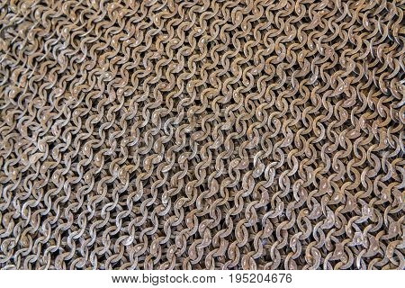 Medieval knight's armor mail frame. With flat rings that make chain slaves.Texture of chainmail of a medieval armor knight, Pattern, background, closeup, detail