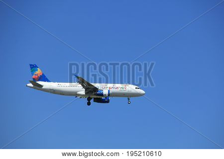 Amsterdam the Netherlands - July 9th 2017: LY-SPA Small Planet Airlines Airbus A320 approaching Schiphol Amsterdam Airport Kaagbaan runway