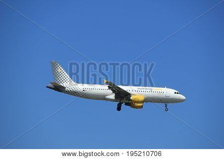 Amsterdam the Netherlands - July 9th 2017: EC-MBF Vueling Airbus A320 approaching Schiphol Amsterdam Airport Kaagbaan runway