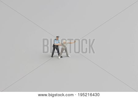 Mini Figure Of Policeman With Hand Cuffs