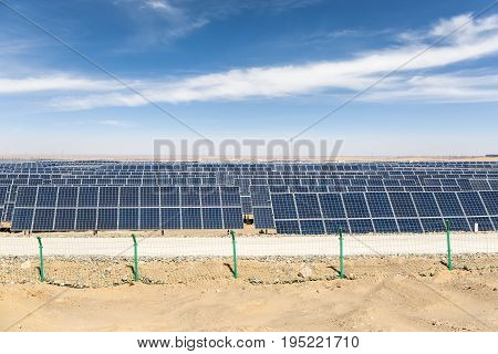 solar panels in golmud city new energy on the gobi desert against a blue sky