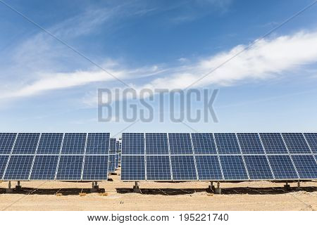 solar panels in golmud city new energy on the gobi desert against a blue sky