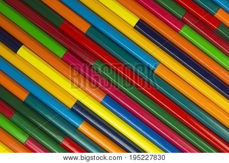 Collection of coloured pencils in a diagonal complementary colors set up as background picture