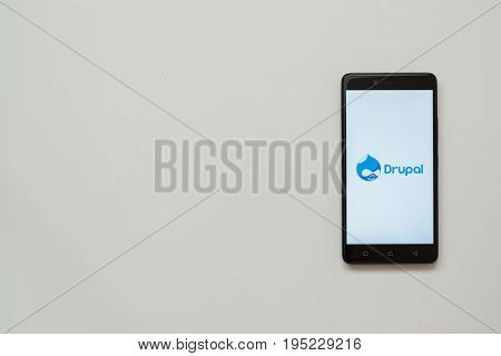Los Angeles, USA, july 13, 2017: Drupal logo on smartphone screen on white background.