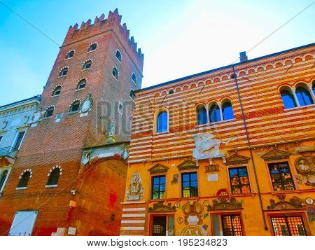 Verona, Italy - September 22, 2014: Piazza delle erbe in Verona street and market view with Lamberti tower, tourist destination in Veneto region of Italy at September 22, 2014
