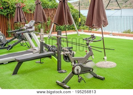 Gym on the terrace with an artificial turf by the sea in the open air Greece Crete