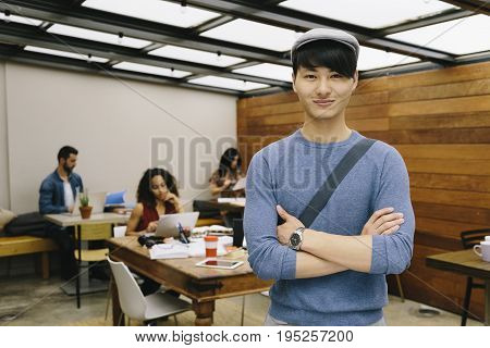 Portrait of confident creative businessman in coworking office