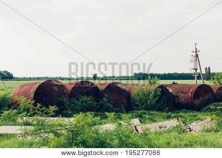An Old Rusty Tanker For Gasoline Is Thrown In Old Technopark Of Chernobyl After Accident At Nuclear