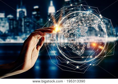 Hand with abstract globe on blurry night city background. Digital global ommunication concept. Double exposure