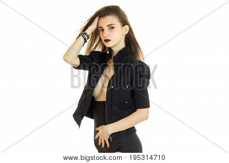Beautiful young woman with big natural breasts in panties and jacket isolated on white background