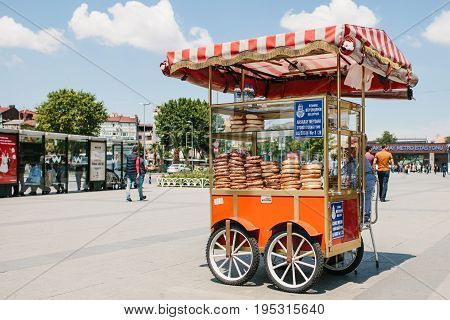 Istanbul, June 11, 2017: Sale of a traditional Turkish bagel called Simit on the square next to the metro station Aksaray in Istanbul, Turkey. Turkish food.