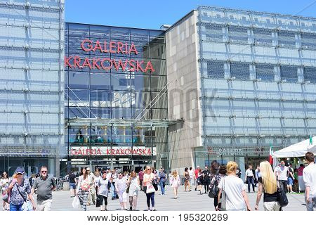 KRAKOW POLAND - JUNE 2017: more people walk at the entrance of Galeria Krakowska shopping center.