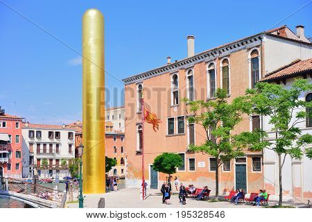 VENICE ITALY - MAY 2017: James Lee byars 20-meter-tall "golden tower" erected along venice's grand canal. Venice art biennale.