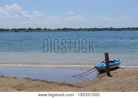 Kayak on shore of lake at Standley Lake Regional Park in Westminster Colorado