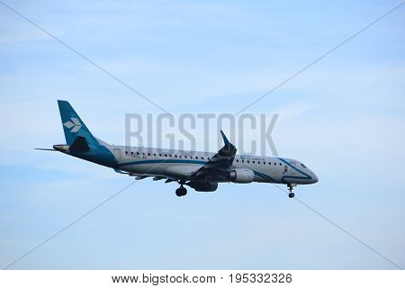 Amsterdam the Netherlands - July 7th 2017: I-ADJO Air Dolomiti Embraer ERJ-195LR approaching Schiphol Amsterdam Airport Polderbaan runway