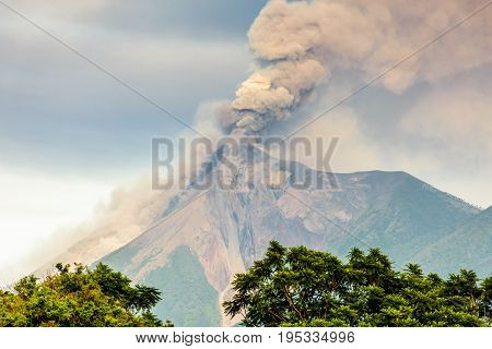 Smoke billows from erupting Fuego volcano just after dawn near Antigua, Guatemala, Central America