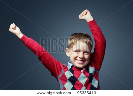 happy boy isolated against grey background