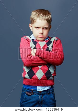 angry boy isolated against grey background