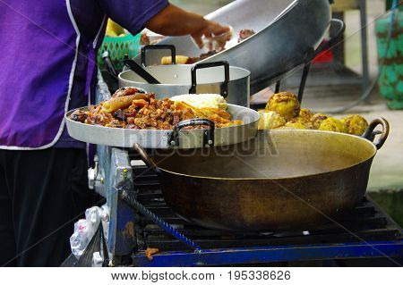 Close up of hornado roasted pork with a corn, ecuadorian traditional typical andean food over a tray .