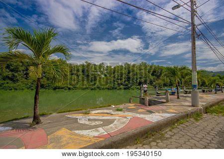ATACAMES, ECUADOR - March 16, 2016: Unidentified man enjoying the view near of a river in Atacames, Ecuador.