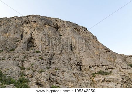 High mountain with smooth walls and uneven top unapproachable majestic