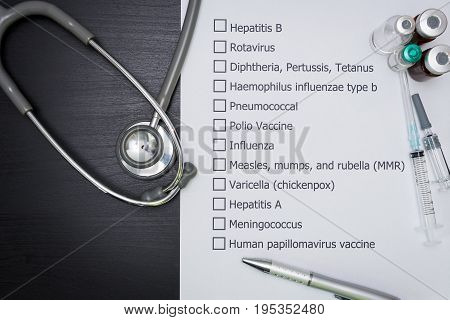 Doctor are checking his patient's Vaccination schedule.