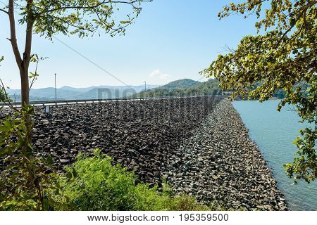 The rock wall of Queen Sirikit Dam in Uttaradit Province, Thailand, in perspective view