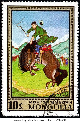 UKRAINE - CIRCA 2017: A postage stamp printed in Mongolia shows Taming Wild Horse from the series Paintings by contemporary artists in Ulan Bator Museum circa 1972