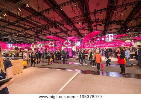 HANNOVER GERMANY - MARCH 14 2016: Booth of Deutsche Telekom company at CeBIT information technology trade show in Hannover Germany on March 14 2016.