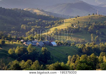Beautiful summer sunrise in Bucovina village, Romania