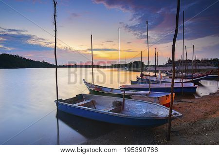 A row of fisherman boat at the river during sunset