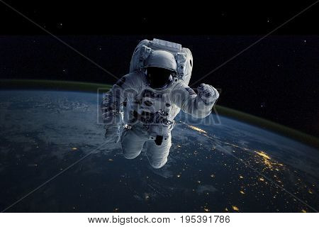 Astronaut in outer space. Elements of this image furnished by NASA