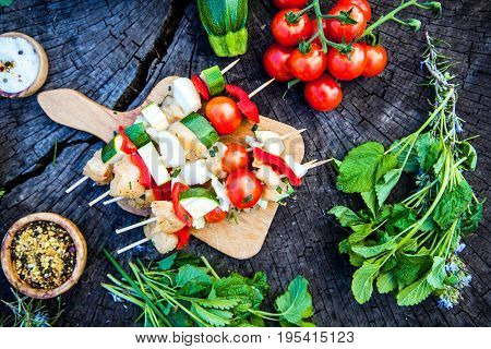 BBQ barbecue ingredients. Marinated BBQ meat. Marinated grill chicken and kebab. Vegetables and meat for barbecue
