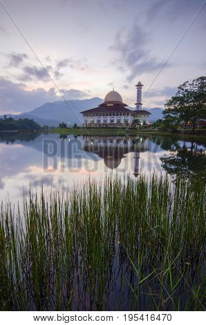 Mirror Reflection Of Beautiful Mosque During Sunrise.