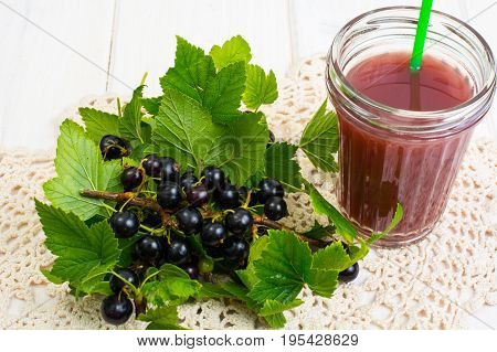 Useful vitamin fresh juice in glass on wooden table. Studio Photo