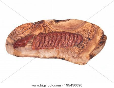 Guylai kolbasz, hungarian smoked sausage on natural olive wood cutting board