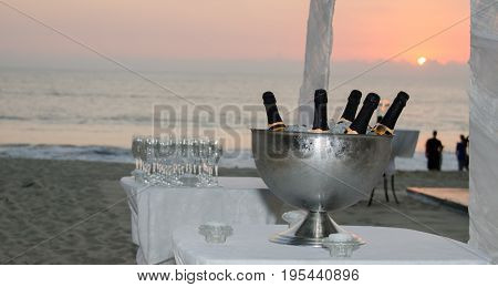 Sunset party on the beach with champagne