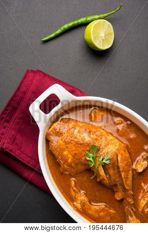 Indian spicy Chicken curry or masala chicken with prominent leg piece, popular recipe from India, selective focus