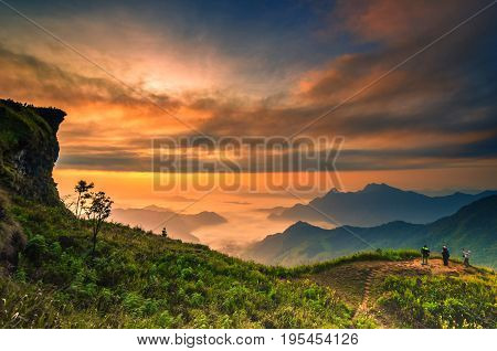 Background blur sea fog on the mountain with the sky and clouds of yellow orange Phu Chi Fa in Thailand.