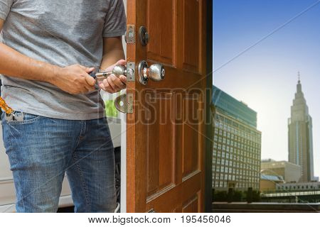 locksmith open the wood door by cylinder tools to cityscape - can use to display or montage on product