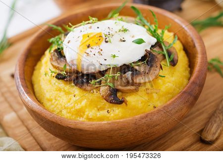 Breakfast. Polenta With Mushrooms And Poached Egg