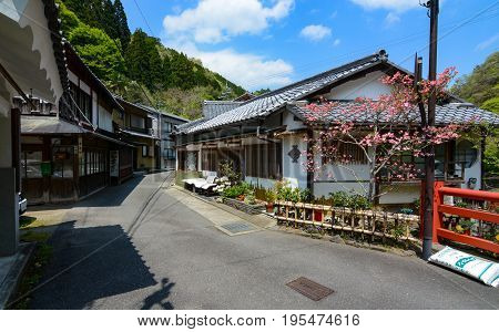 KYOTO, JAPAN - APRIL 19, 2016 - Shops in the small village of Sagakiyotakicho line the street leading to Mount Atago