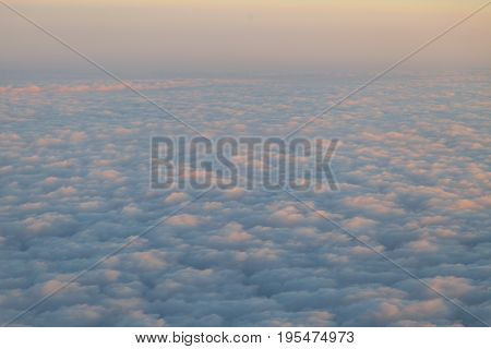 the sky above the clouds from aircraft iljuminatora at sunset