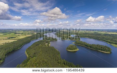 Aerial View Of Green Islands And Clouds At Summer Sunny Day.wydminy Lake On Masuria In Poland.