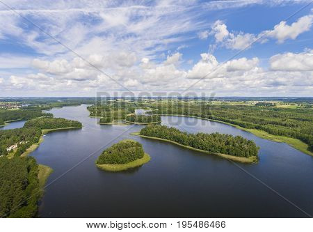 Aerial View Of Green Islands And Clouds At Summer Sunny Day.wydminy Lake On Masuria In Poland.